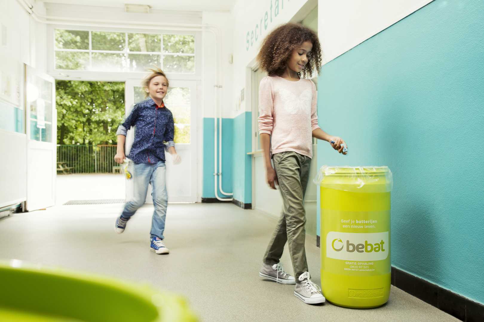 kids collecting batteries at school